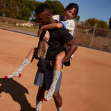 Socks That Support Youth Sports | Grey Baseballs